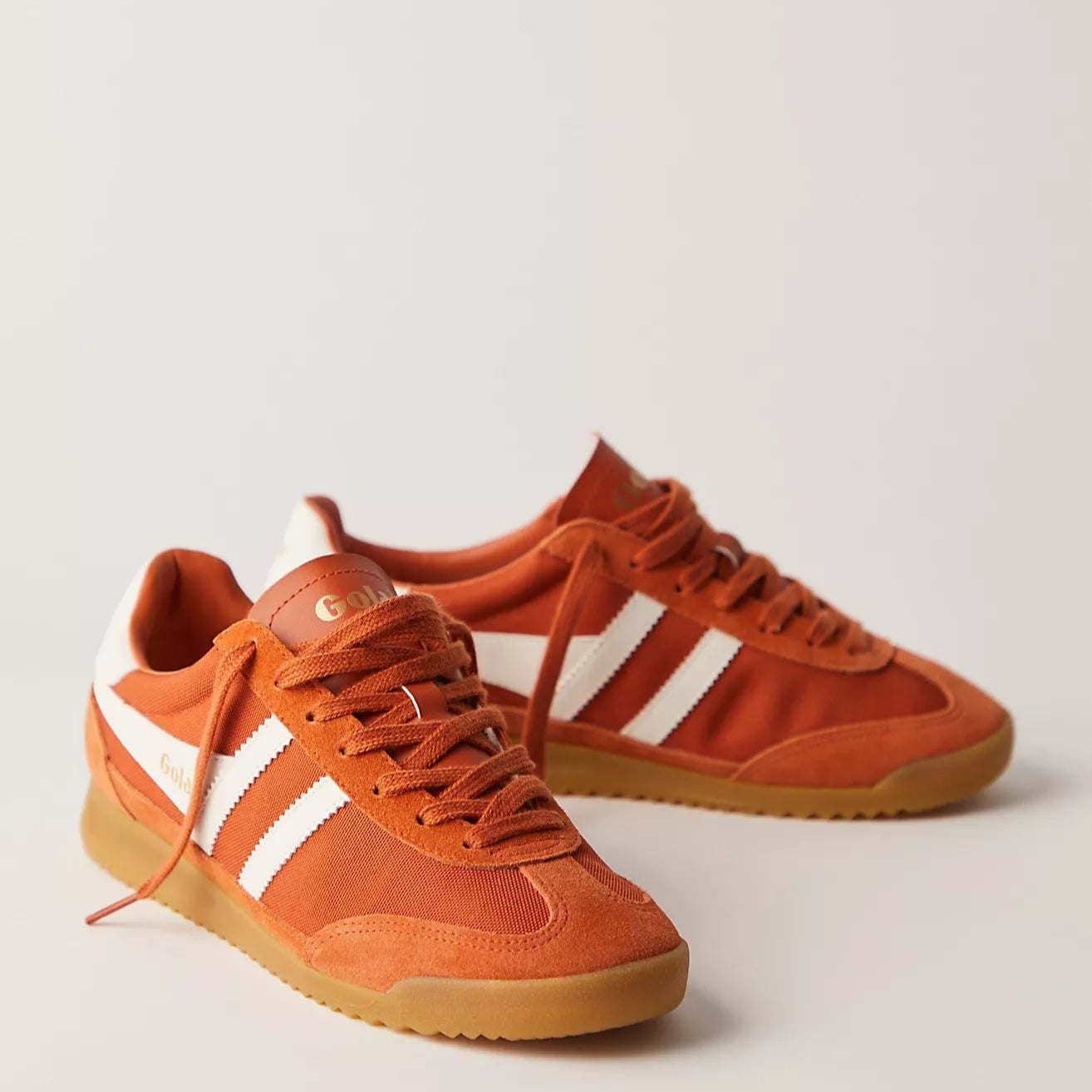 Gola Tornado Sneakers In A rust orange color with Rust Laces and white stripes with a rubber Gum Sole