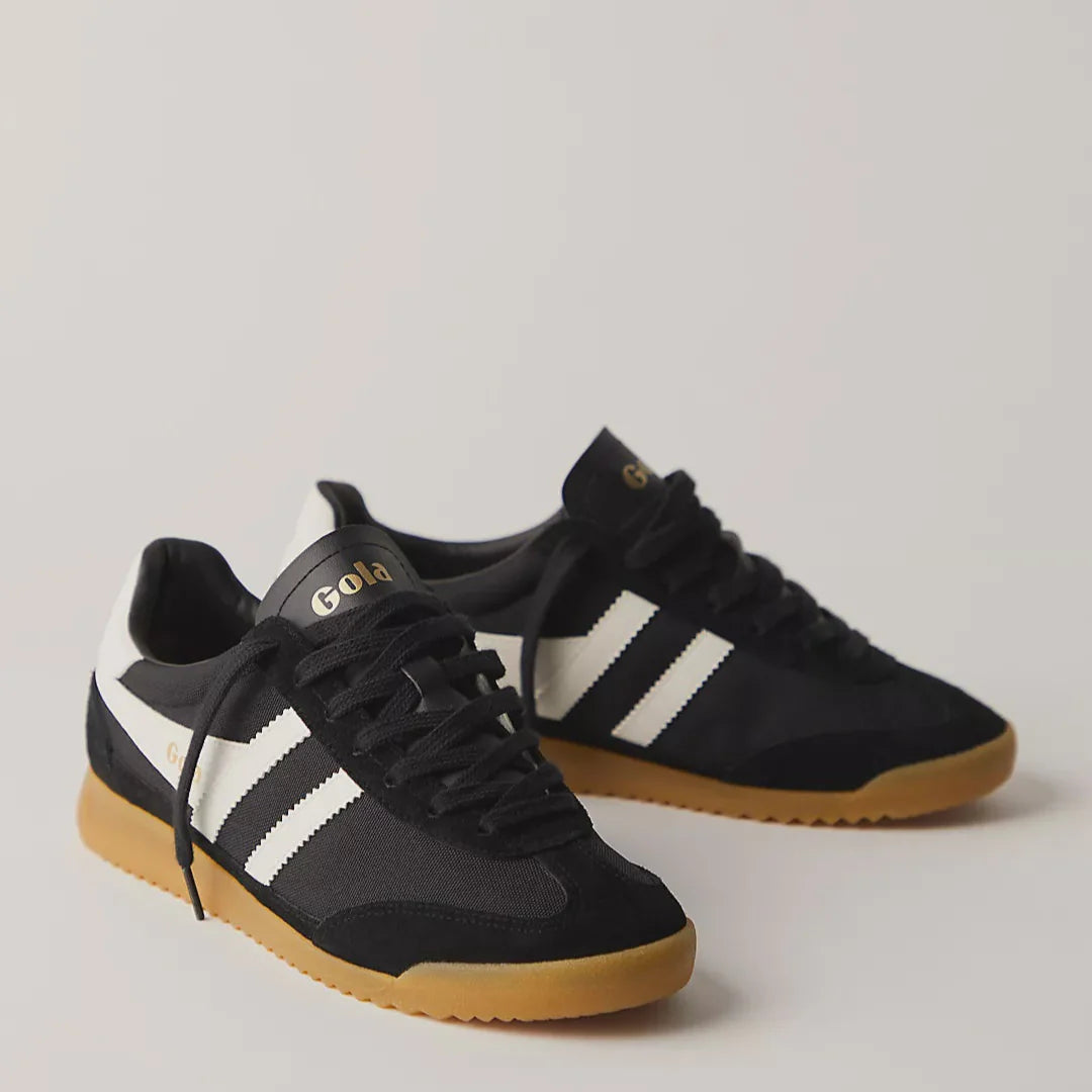 pictured is a pair of the Black Tornado Gola Sneaker with a gum sole and white stripes with black laces.