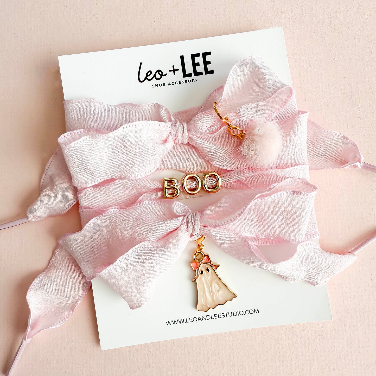Pink ribbon sneaker lace set with BOO letters, pom-pom, and ghost charm