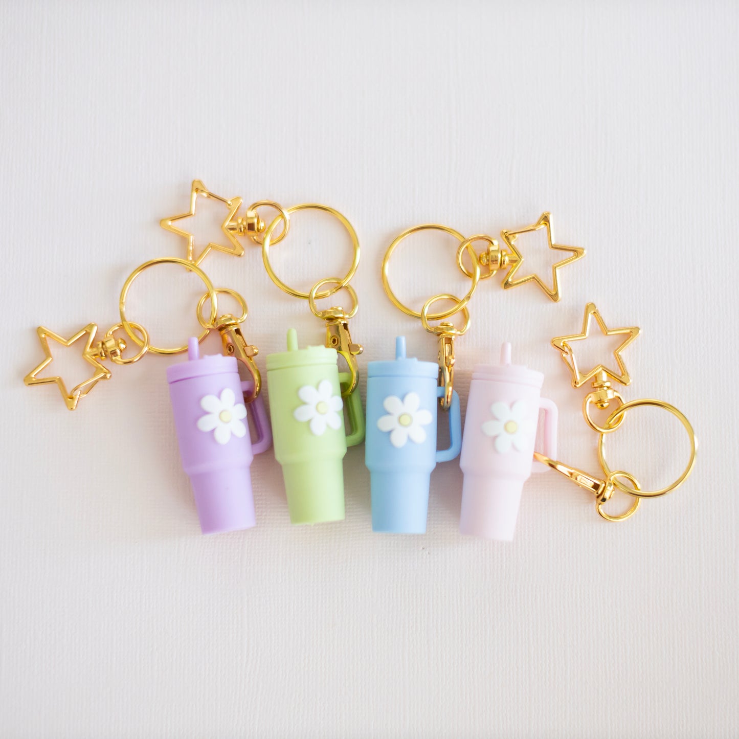 Pastel mini Stanley cup keychain with flower charm and gold star keyring