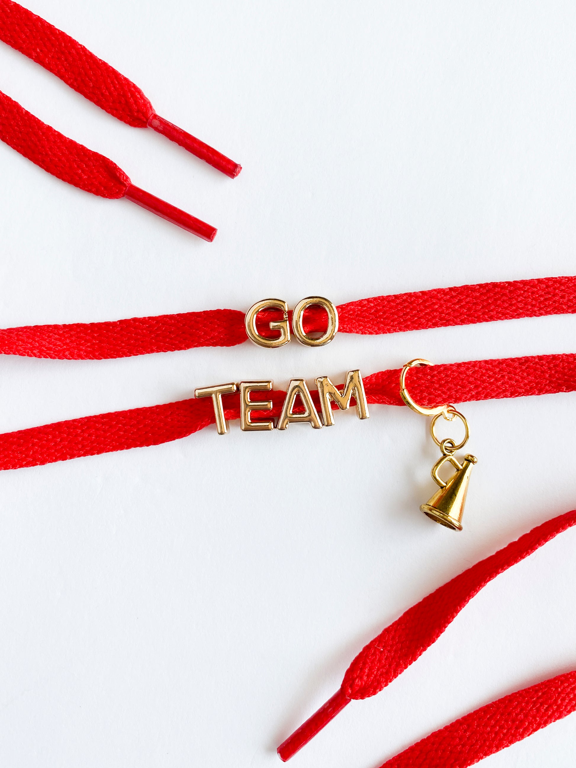 GO TEAM cheerleader lace shoe charm set with gold letters and megaphone on colorful flat laces