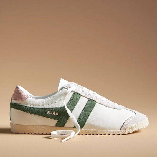Pair of Gola Pure Sneaker Evergreen in white leather with green suede side stripes, featuring a retro-inspired design and lace-up closure on a beige background
