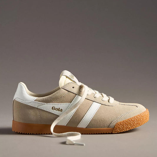A pair of Gola Elan sneakers in a bone and white colorway, featuring a suede upper with white leather stripes, cream laces, and a gum rubber sole. The "Gola" logo is embossed in gold on the tongue and side.