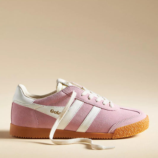 A close-up of the Gola Elan sneakers in Pink Candy & White, featuring a soft pink suede upper, white leather stripes, and a gum rubber sole. The "Gola" logo is embossed in gold on the side, with cream laces adding to the retro aesthetic.
