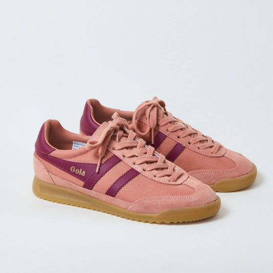 Pair of pink sneakers with purple accents on a light gray background